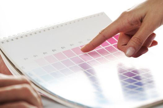 woman Choosing color from color scale