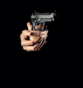 woman with a gun, black background, only hand