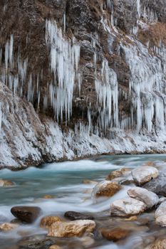Partly frozen river Kokra in Slovenia.