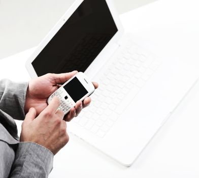 top view of a businesman's hands with a smart phone