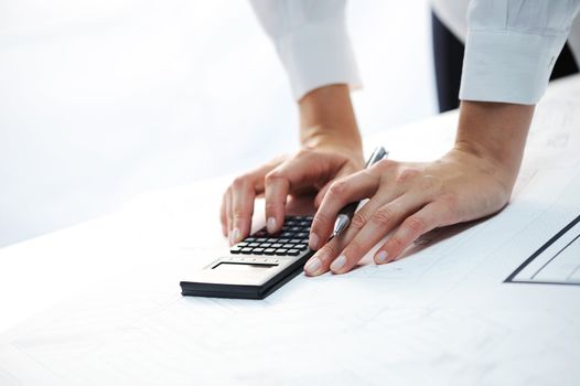 woman's hands with a calculator 