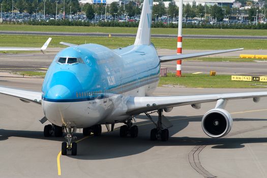 AMSTERDAM - JUNE 16: KLM Royal Dutch Airlines Boeing 747-400 at Schiphol airport June 16, 2009 in Amsterdam, Netherlands. KLM offers worldwide scheduled passenger, cargo services. Direct routes offered by KLM and partners from Amsterdam is 77 intercontinental and 80 European destinations. It's the oldest airline still operating under original name.