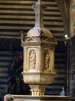 Siena - baptismal font situated in the central place of the Baptistery