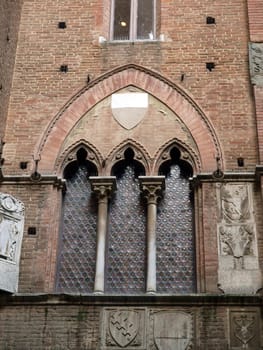 Wall of the courtyard in Palazzo Pubblico. Siena, Tuscany