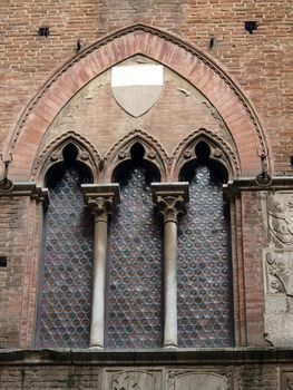 Wall of the courtyard in Palazzo Pubblico. Siena, Tuscany