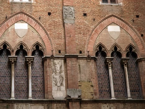 Wall of the courtyard in Palazzo Pubblico. Siena, Tuscany