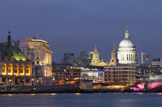 View of the Thames and St Paul's Cathedral at dusk. Lighting of buildings already on, but the sky was still bright. The most beautiful moment. London. UK
