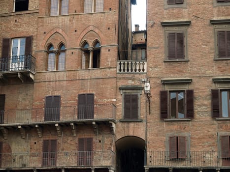 Siena - brick facades of Gothic buildings at Piazza Del Campo