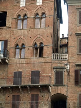 Siena - brick facades of Gothic buildings at Piazza Del Campo