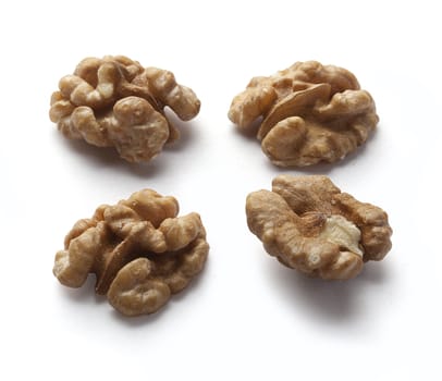 Four pieces of walnut on the white background
