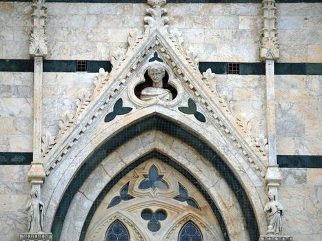 Architectural details of Duomo - Siena,Tuscany,Italy. The Duomo of Siena, which was built in the 12th and 13th centuries, is one of the prettiest churches in Gothic style in Italy