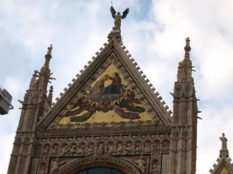 Siena - Duomo facade.The large central mosaic, the Coronation of the Virgin, is the work of Luigi Mussini