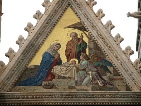 Siena - Duomo facade.The smaller mosaic, Nativity of Jesus by Alessandro Franchi.