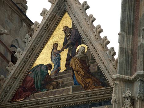 Siena - Duomo facade.The smaller mosaic,Presentation of Mary in the Temple, by Alessandro Franchi.