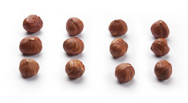 Set of brown hazelnuts on the white background