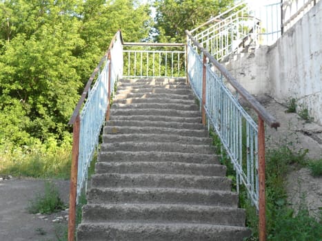 The old staircase with steps of badly
weathered