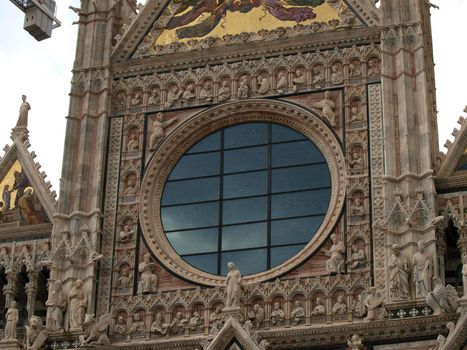 Siena - Duomo facade. The Duomo of Siena, which was built in the 12th and 13th centuries, is one of the prettiest churches in Gothic style in Italy