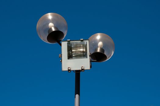 street lamp against a clear blue sky