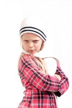 angry little girl in white hat posing over white bacground