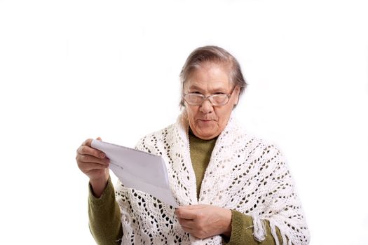old woman holds a letter or a bill