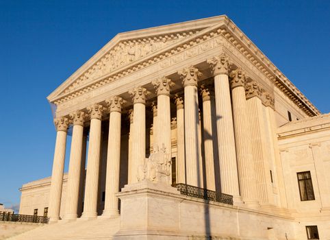 Late afternoon winter sun illuminates front of supreme court in Washington in winter