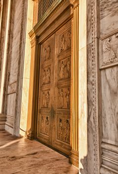 Late afternoon winter sun illuminates front doors of supreme court in Washington