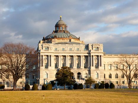 The setting sun lights up the US Library of Congress with warm light in late afternoon