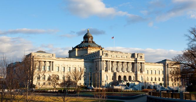 The setting sun lights up the US Library of Congress with warm light in late afternoon