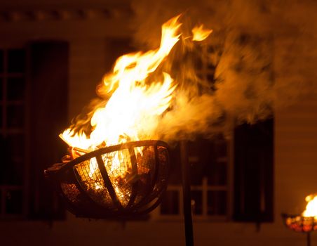 Fiery basket for kindling used to light a street at night