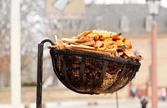 Basket for kindling used to light a street at night