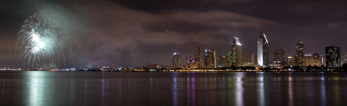 San Diego California City Skyline at Night and Fireworks Celebration Observed from Coronado Island