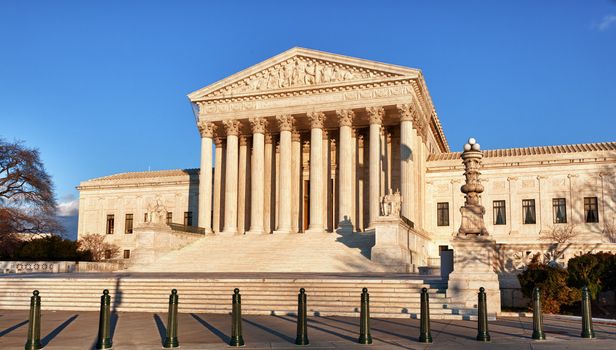 Late afternoon winter sun illuminates front of supreme court in Washington in winter