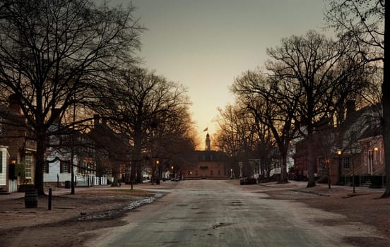 WILLIAMSBURG, VIRGINIA - DECEMBER 30: Sun rises over the Capitol on December 30, 2011. Colonial Williamsburg's 301 acres includes many restored buildings and houses