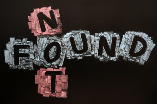Crossword of Not Found drawn with colorful chalk on a blackboard