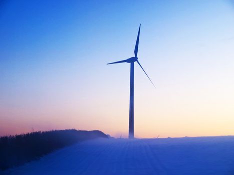 Alternative green energy modern wind mills in snow landscape digital art manipulation