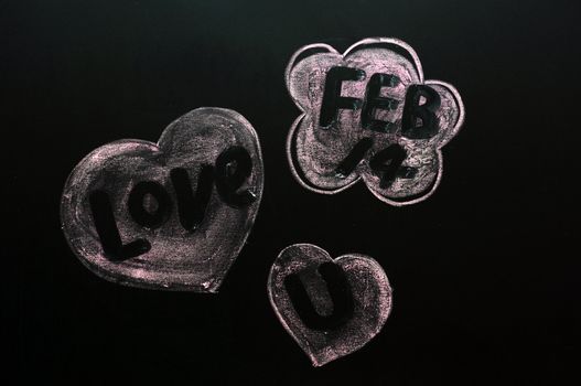 Concept of Saint Valentine's Day drawn with chalk on a blackboard