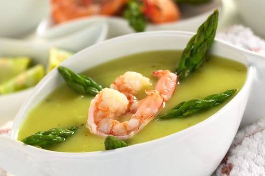 Cream of asparagus with shrimps (Selective Focus, Focus on the lower edge of the shrimp)