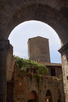 Medieval Arch Stone Tower Medieval Town Pink Flowers San Gimignano Tuscany Italy