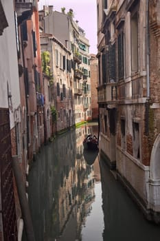 Small CanalBuildings Boats Reflections Venice Italy