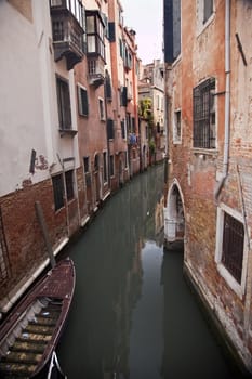 Small Canal Buildings Boats Reflections Venice Italy