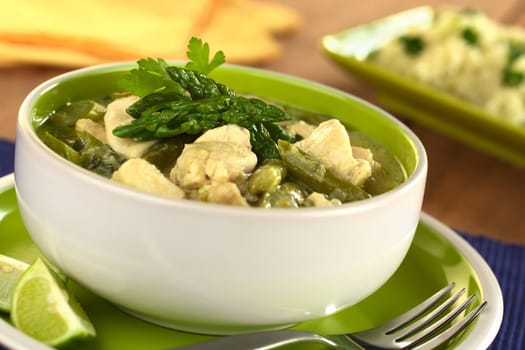 Green asparagus and chicken fricassee (Selective Focus, Focus on the two asparagus tips on the top)