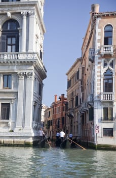 Narrow Canal Buidlings Gondolas Off of Grand Canal Reflections Venice Italy