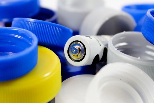 Alkaline battery with bottle caps