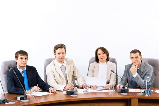 businessmen sitting in a chair at the table, communicate at the conference