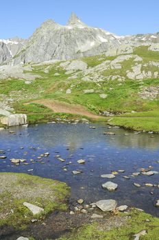 Mountain lake in background with high mountain