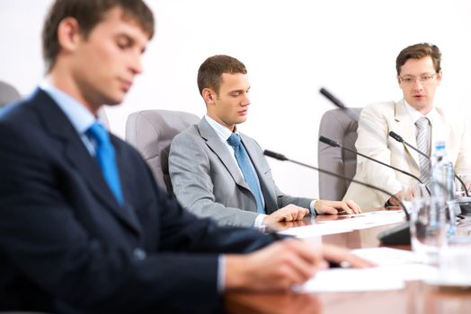 Portrait of a businessman, in the background colleagues communicate with each other