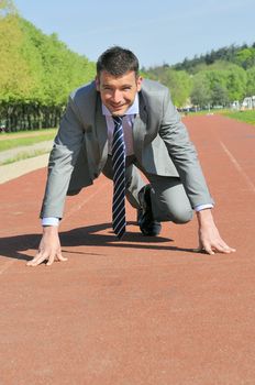 Portrait of a businessman on the starting blocks