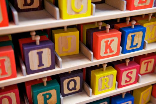 Rows of Brightly Colored Children's Wooden Alphabet Blocks