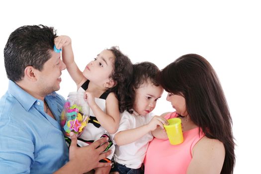 portrait of a nice family playing on white