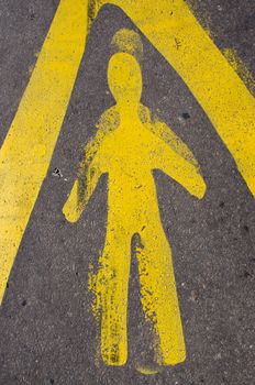 yellow road sign on urban asphalt background